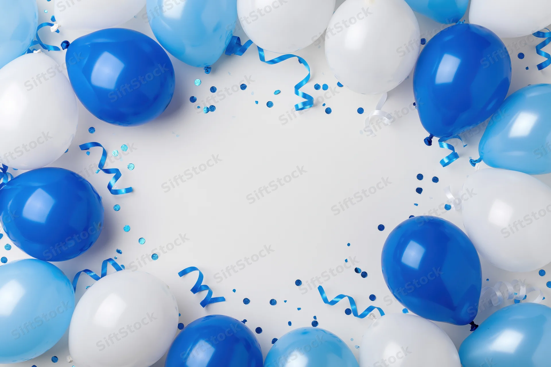 Blue and white helium balloons arranged in a circular border with confetti and streamers on a white surface