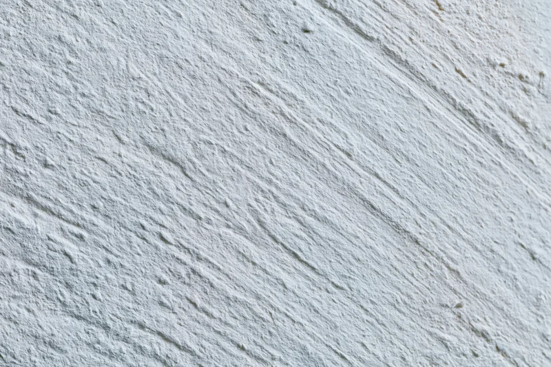 Close-up of rough textured concrete wall surface