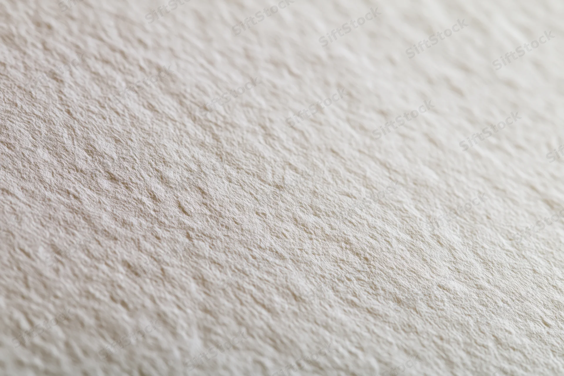 Close-up of white watercolor paper surface with textured grain in flat lay arrangement