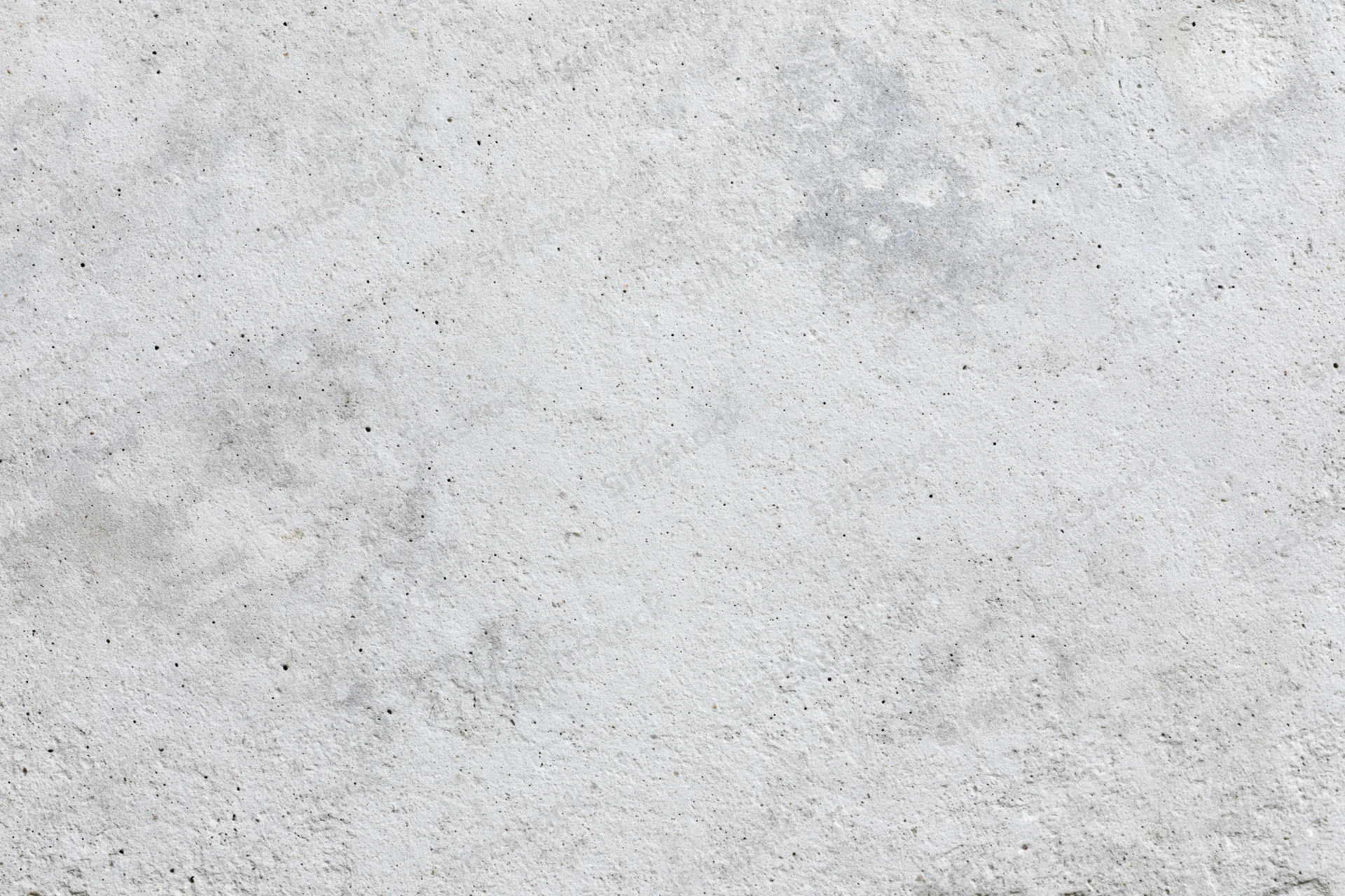 Close-up of a rough gray concrete wall surface filling the frame