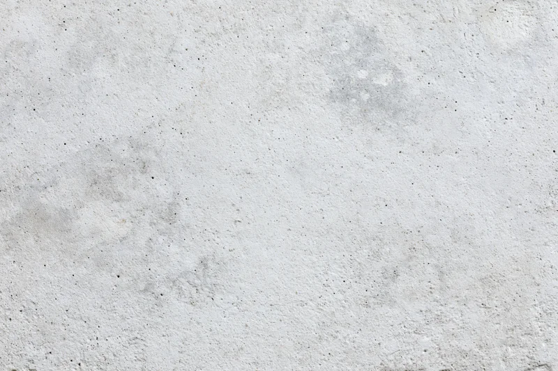 Close-up of a rough gray concrete wall surface filling the frame