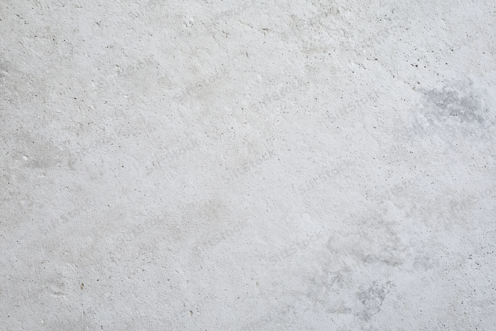 Close-up of a rough gray concrete wall surface filling the frame