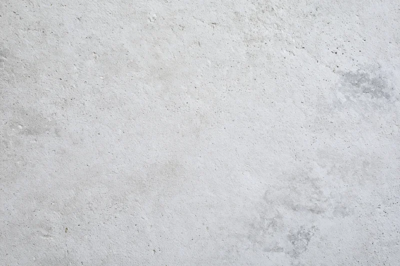 Close-up of a rough gray concrete wall surface filling the frame