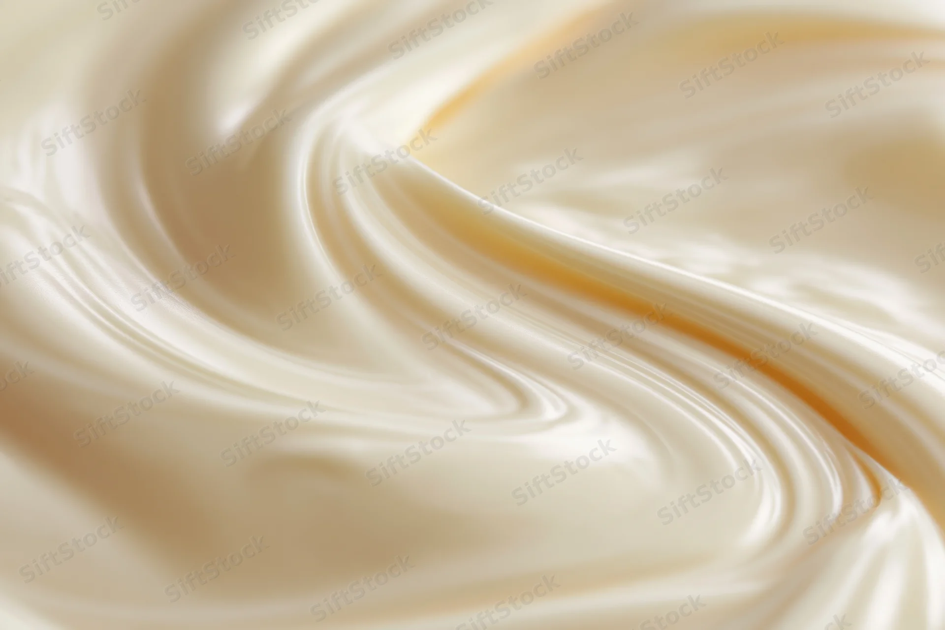Swirling liquid cream in close-up macro view