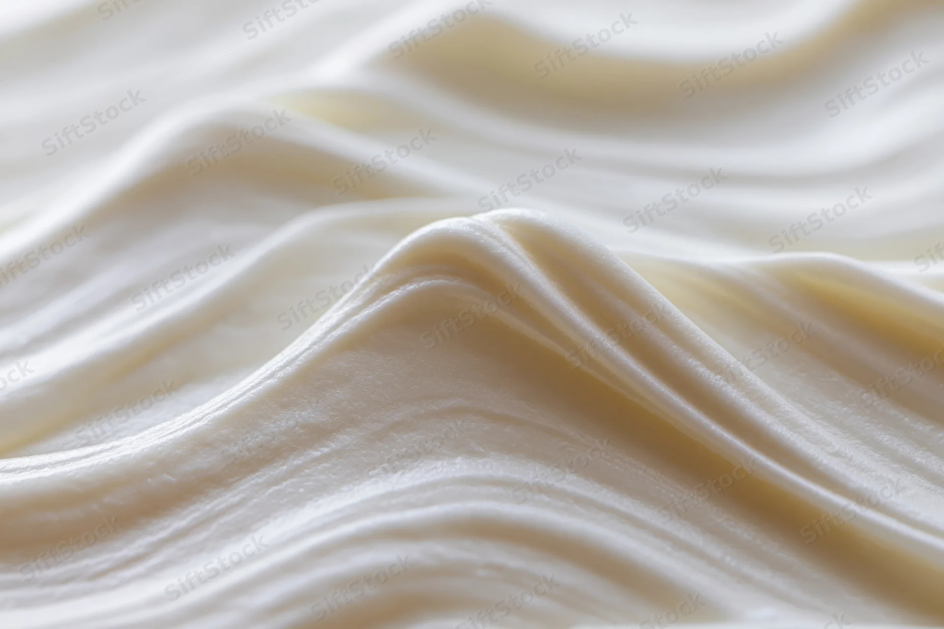 Close-up of thick white cream with smooth glossy texture