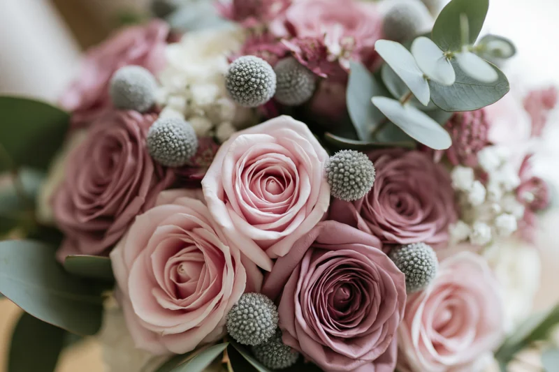 Close-up of a wedding bouquet with blush pink roses and brunia