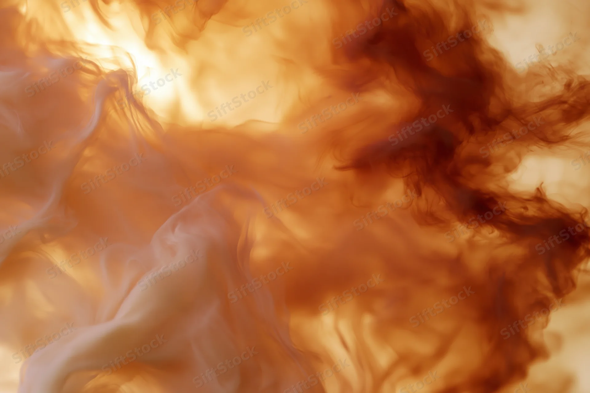 Swirling cream and amber ink dispersing in water against a soft light background