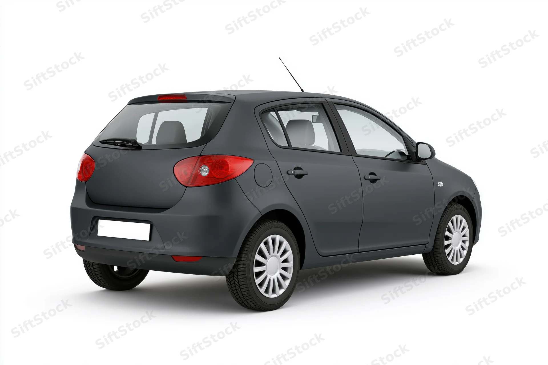 Dark charcoal grey compact hatchback viewed from rear on white background