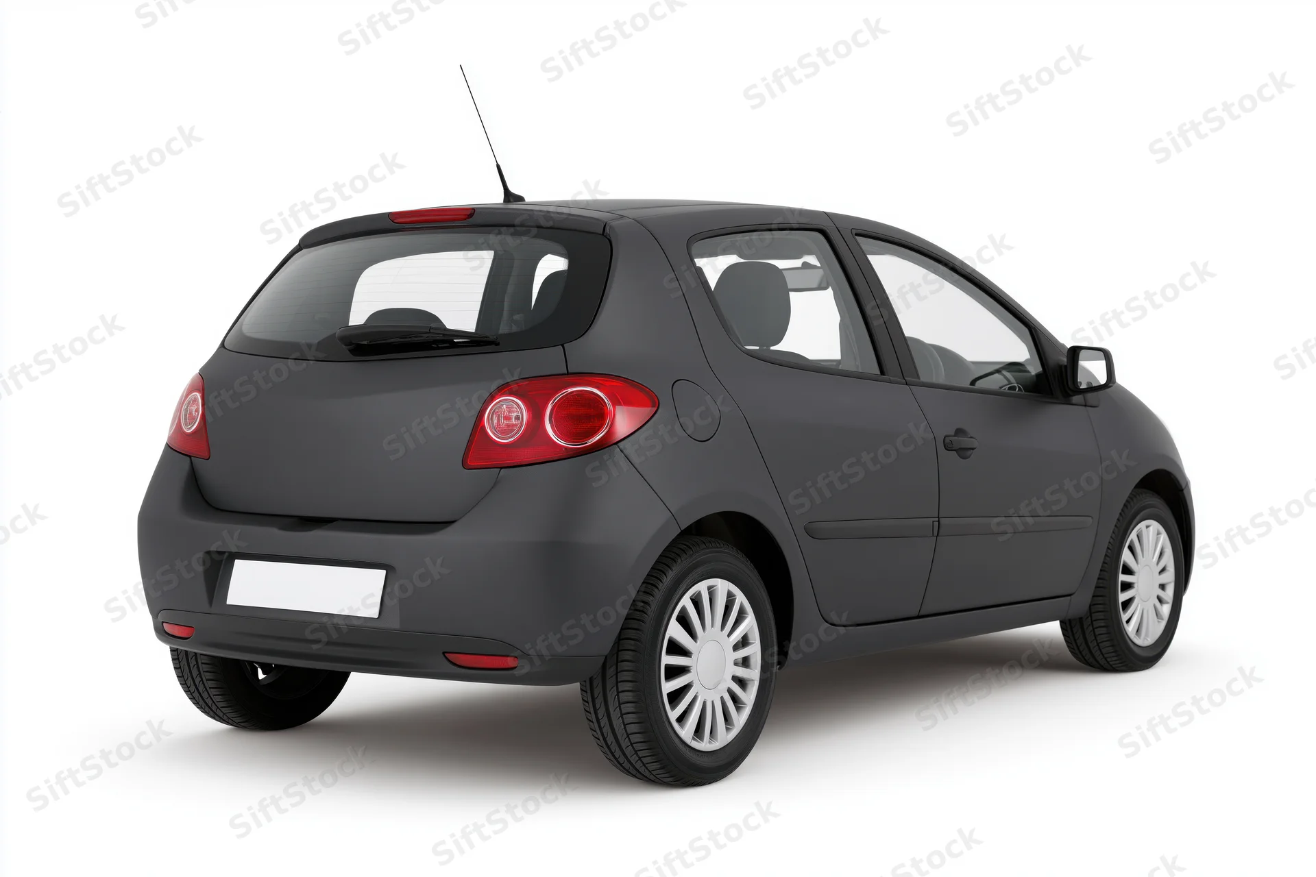 Dark charcoal grey compact hatchback viewed from rear on white background