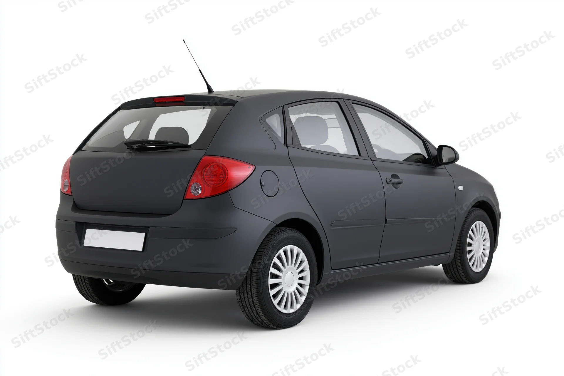 Dark charcoal grey compact hatchback viewed from rear on white background