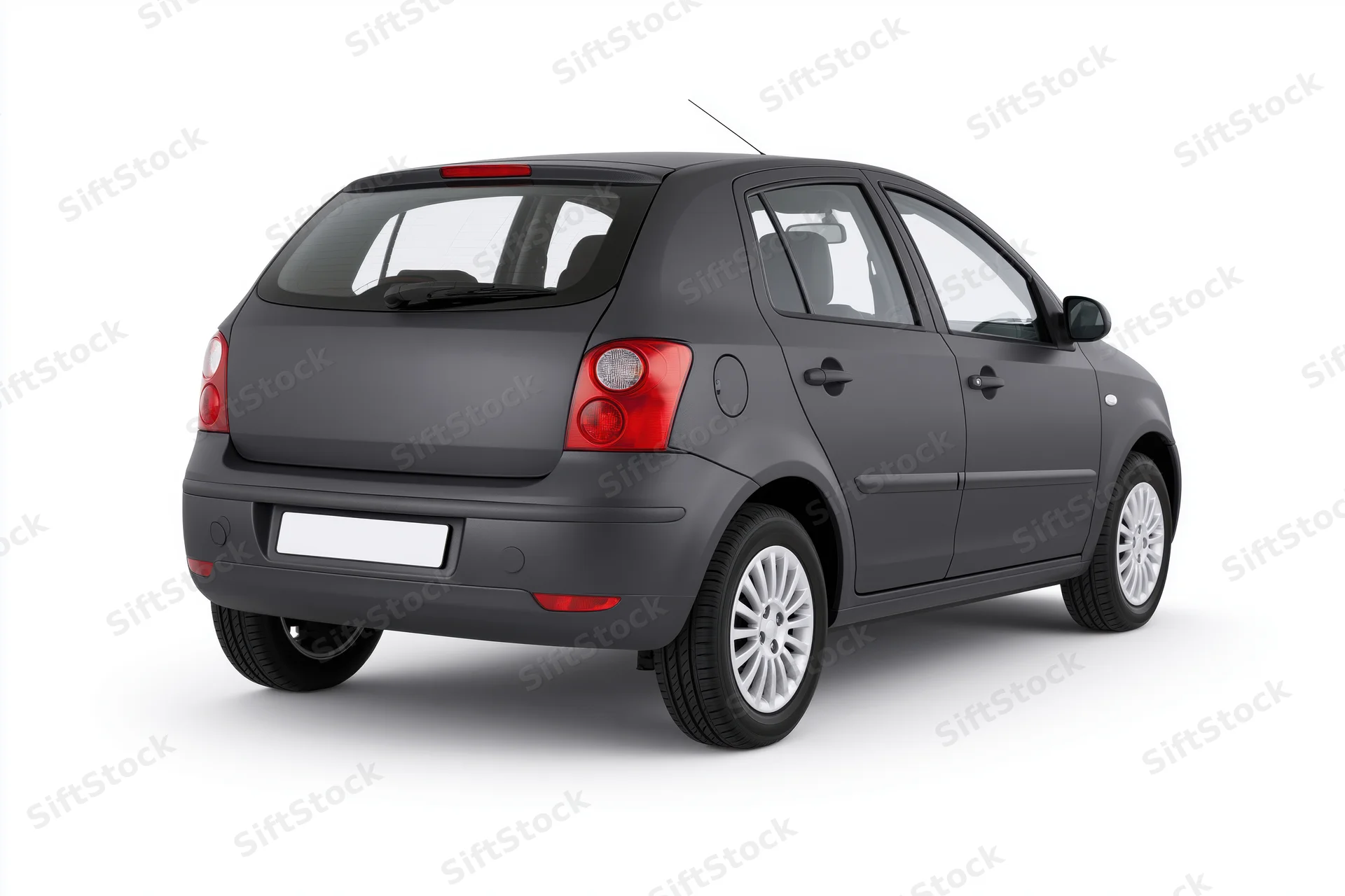 Dark charcoal grey compact hatchback viewed from rear on white background