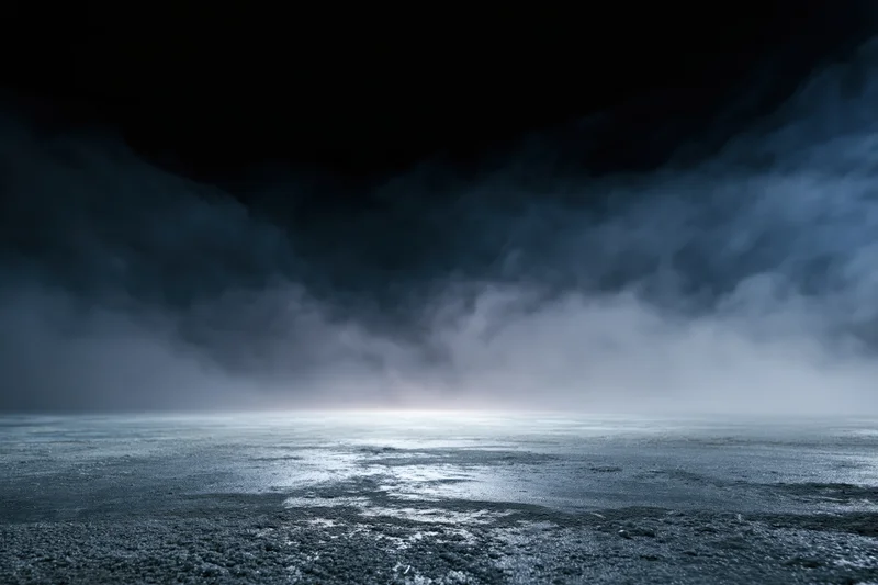 Dark industrial space with empty concrete floor under stormy clouds and fog