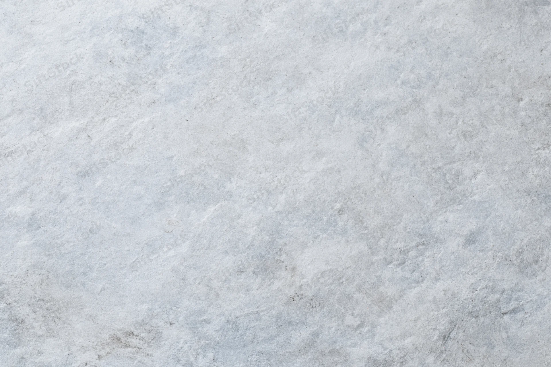 Close-up of a rough gray concrete wall surface filling the frame