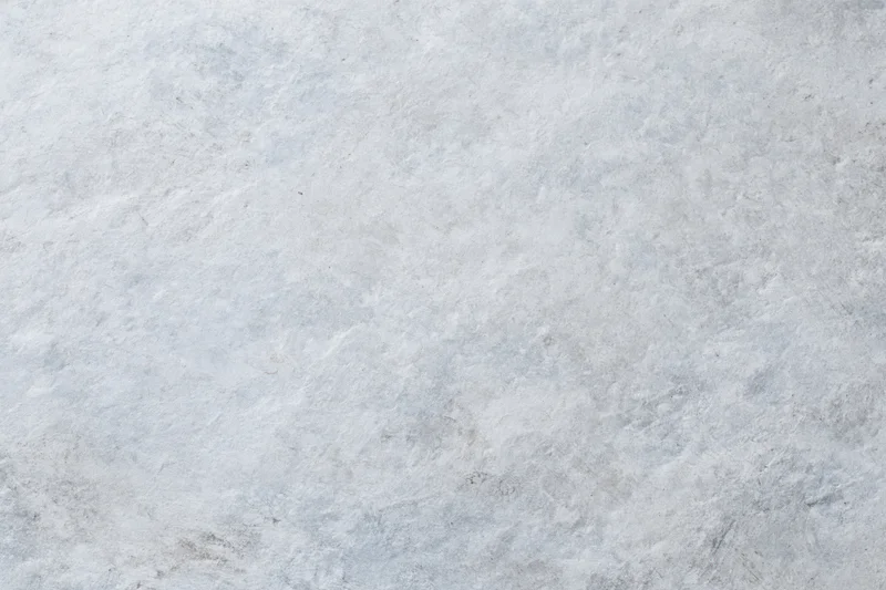 Close-up of a rough gray concrete wall surface filling the frame