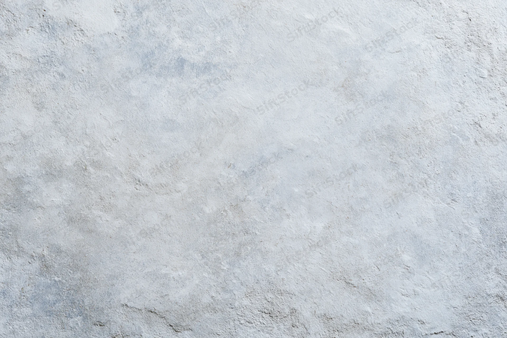Close-up of a rough gray concrete wall surface filling the frame