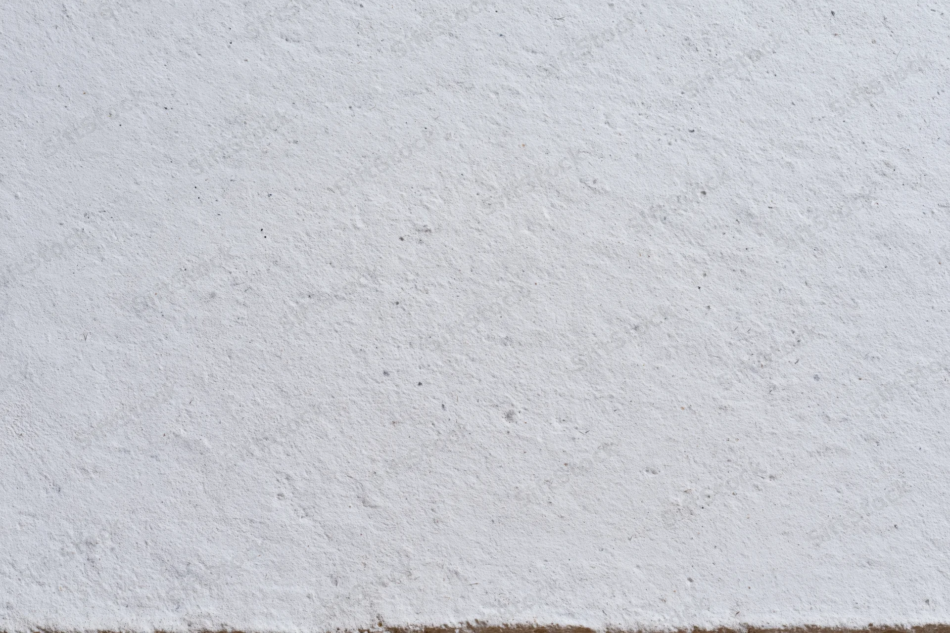 Close-up of a textured concrete wall surface filling the frame