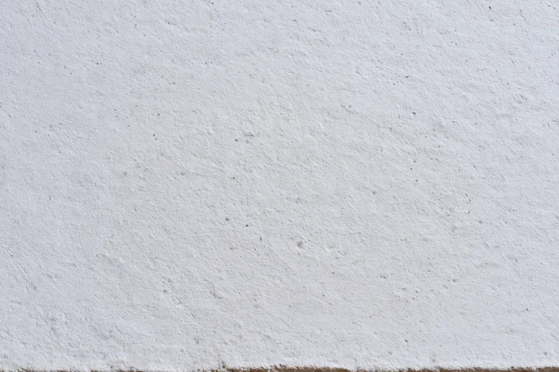 Close-up of a textured concrete wall surface filling the frame