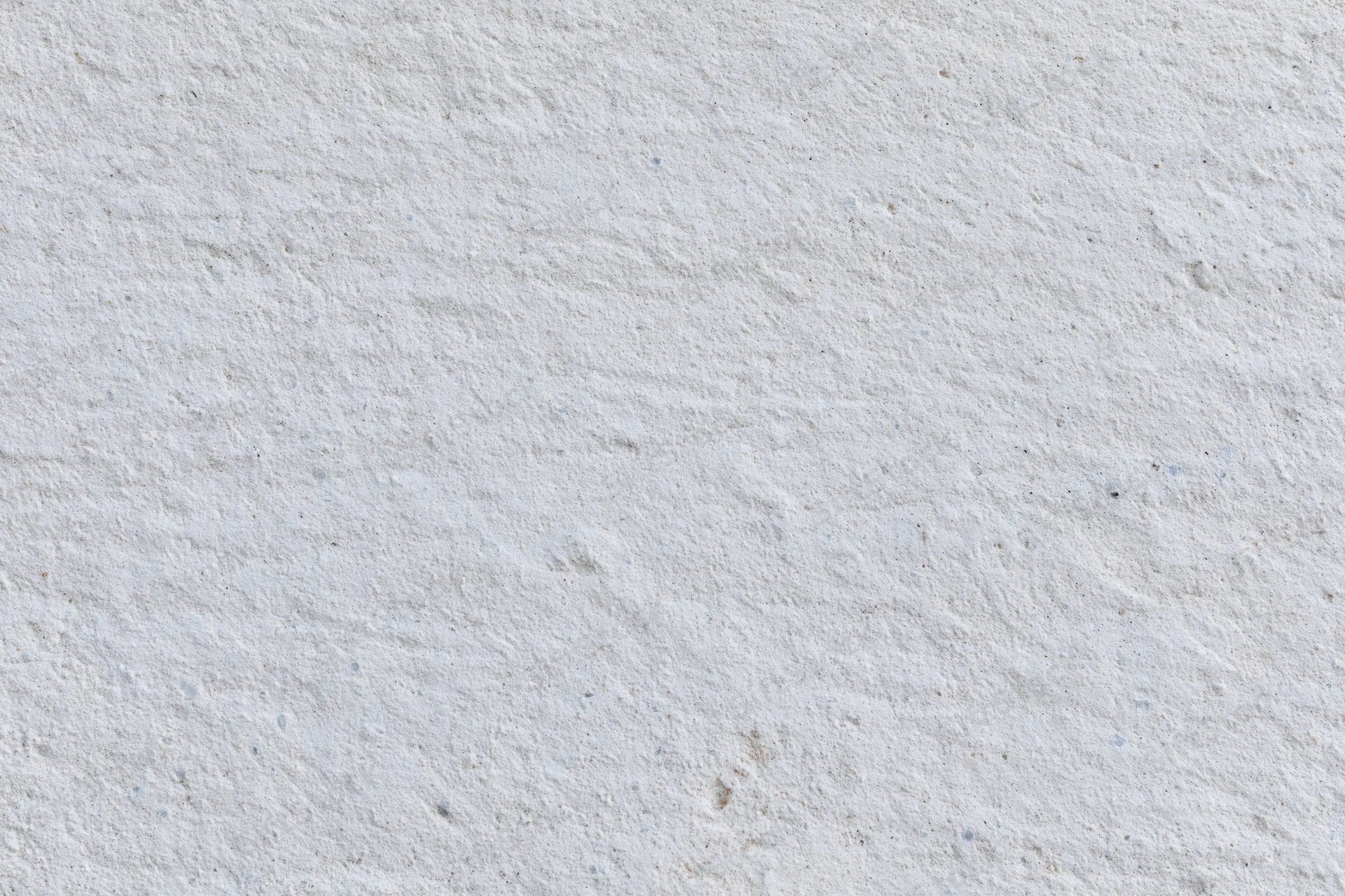 Close-up of a textured concrete wall surface filling the frame