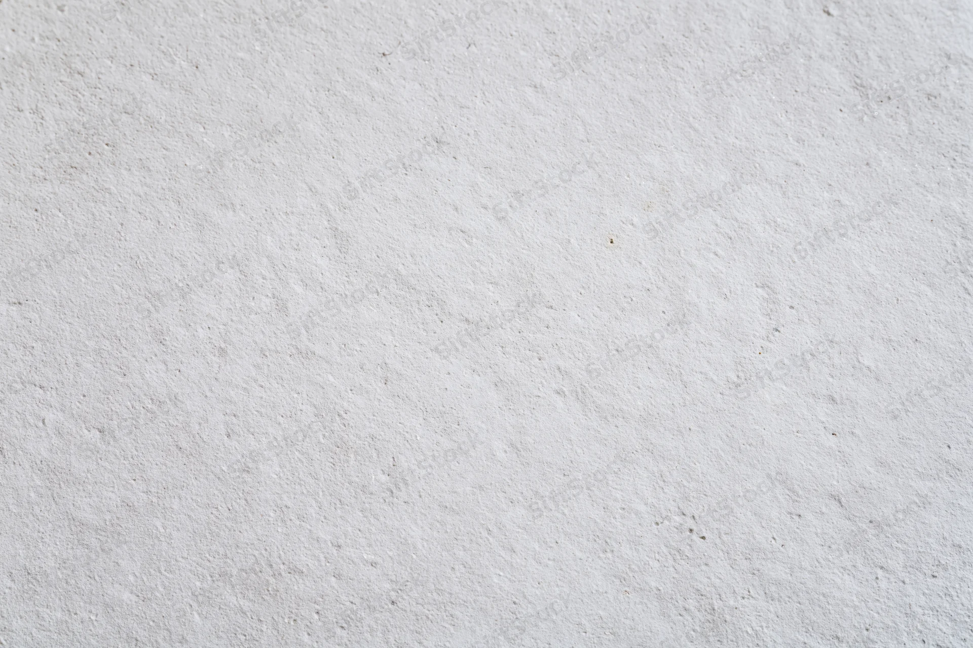 Textured concrete wall surface filling the frame