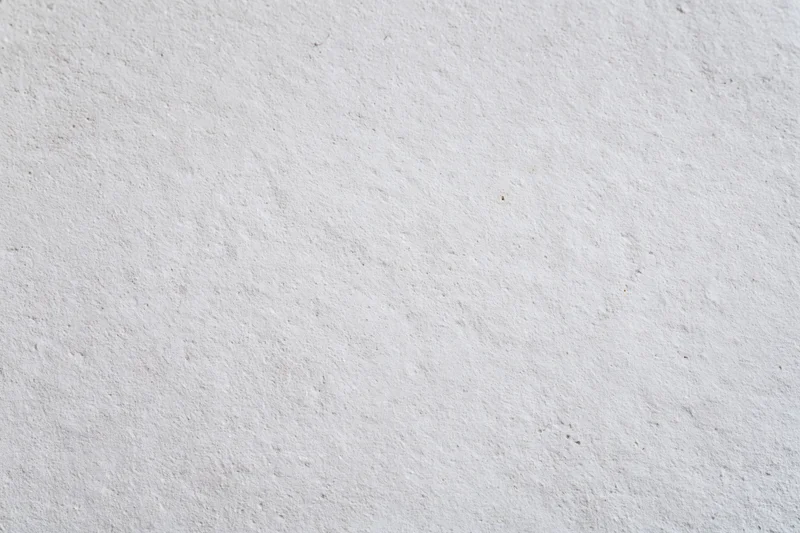 Textured concrete wall surface filling the frame