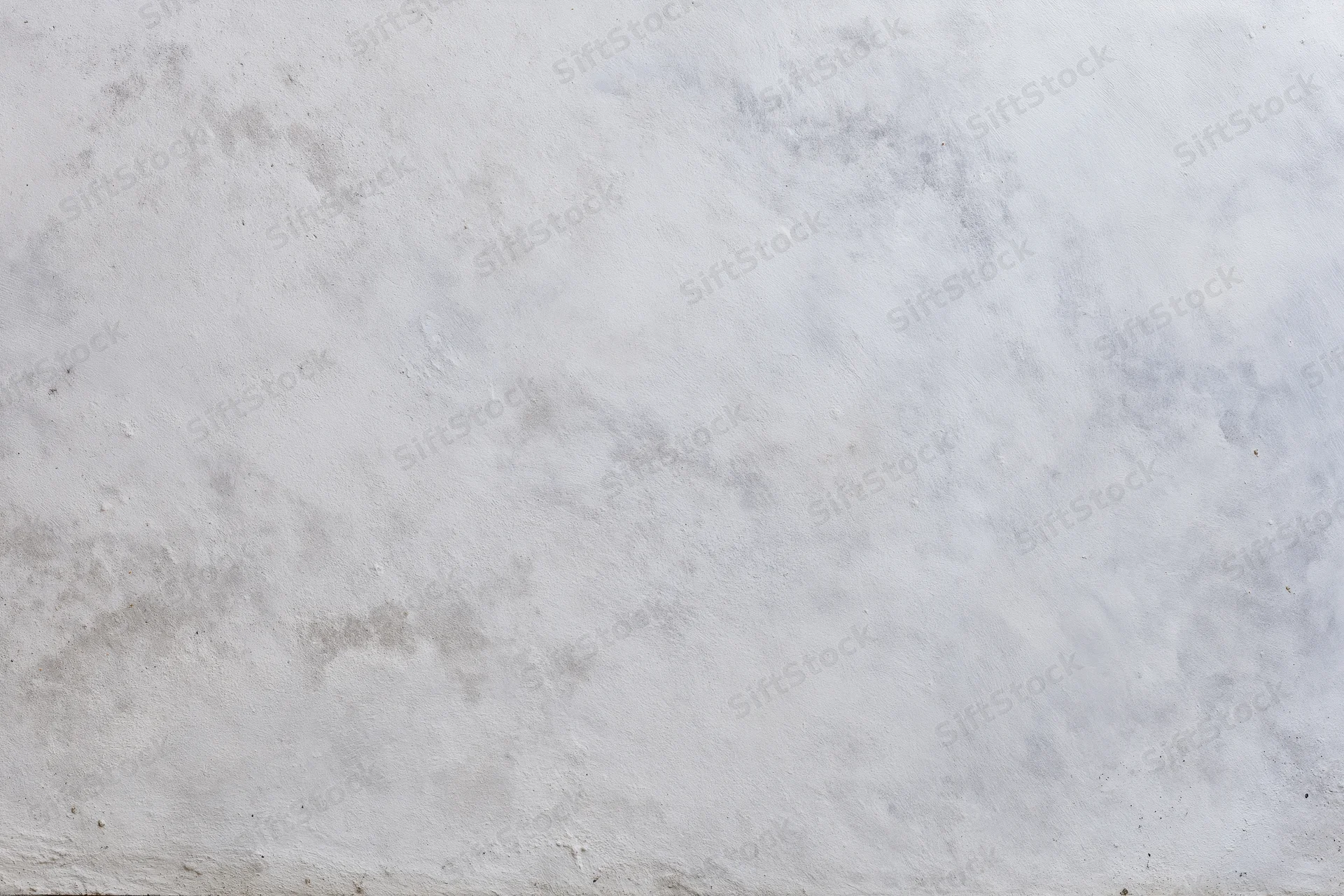 Textured concrete wall surface filling the frame as a neutral backdrop