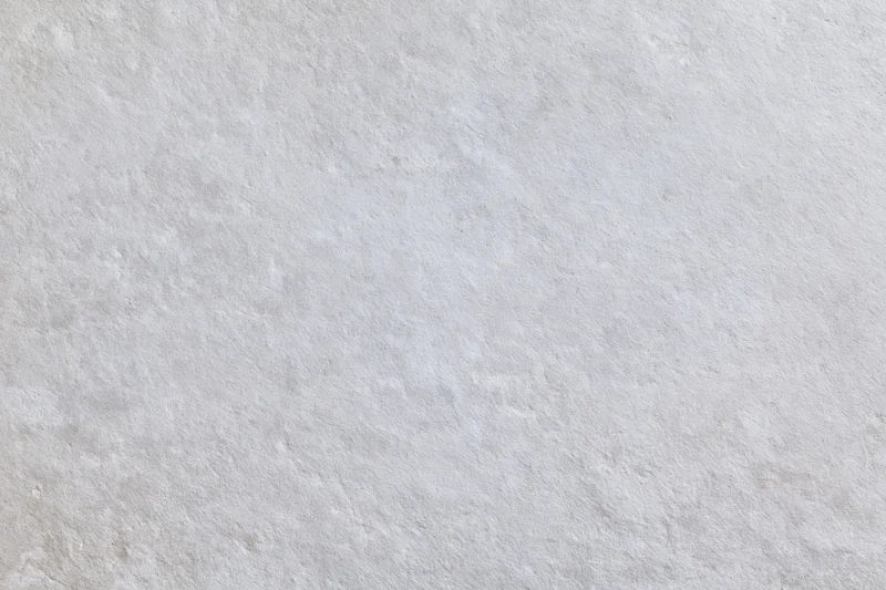 Close-up of a textured concrete wall surface filling the frame