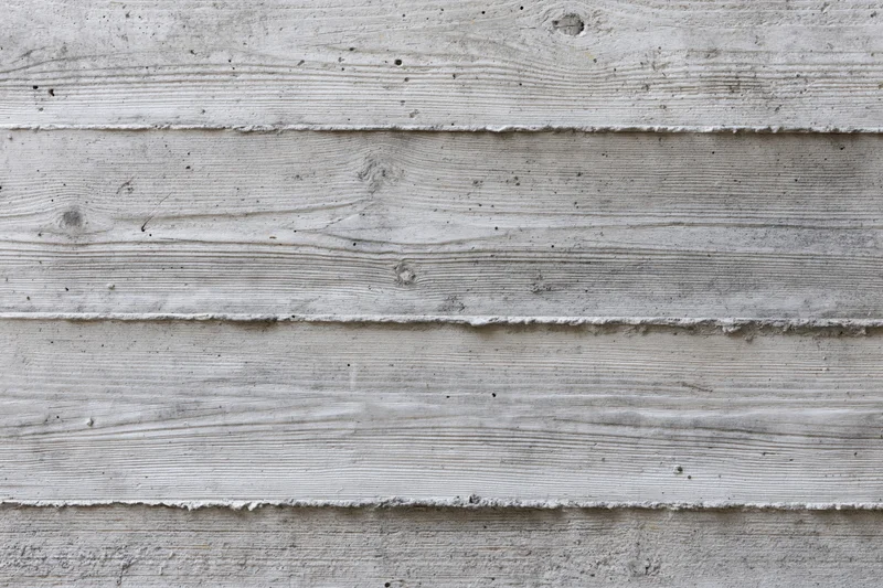 Flat concrete wall with horizontal formwork lines and textured surface