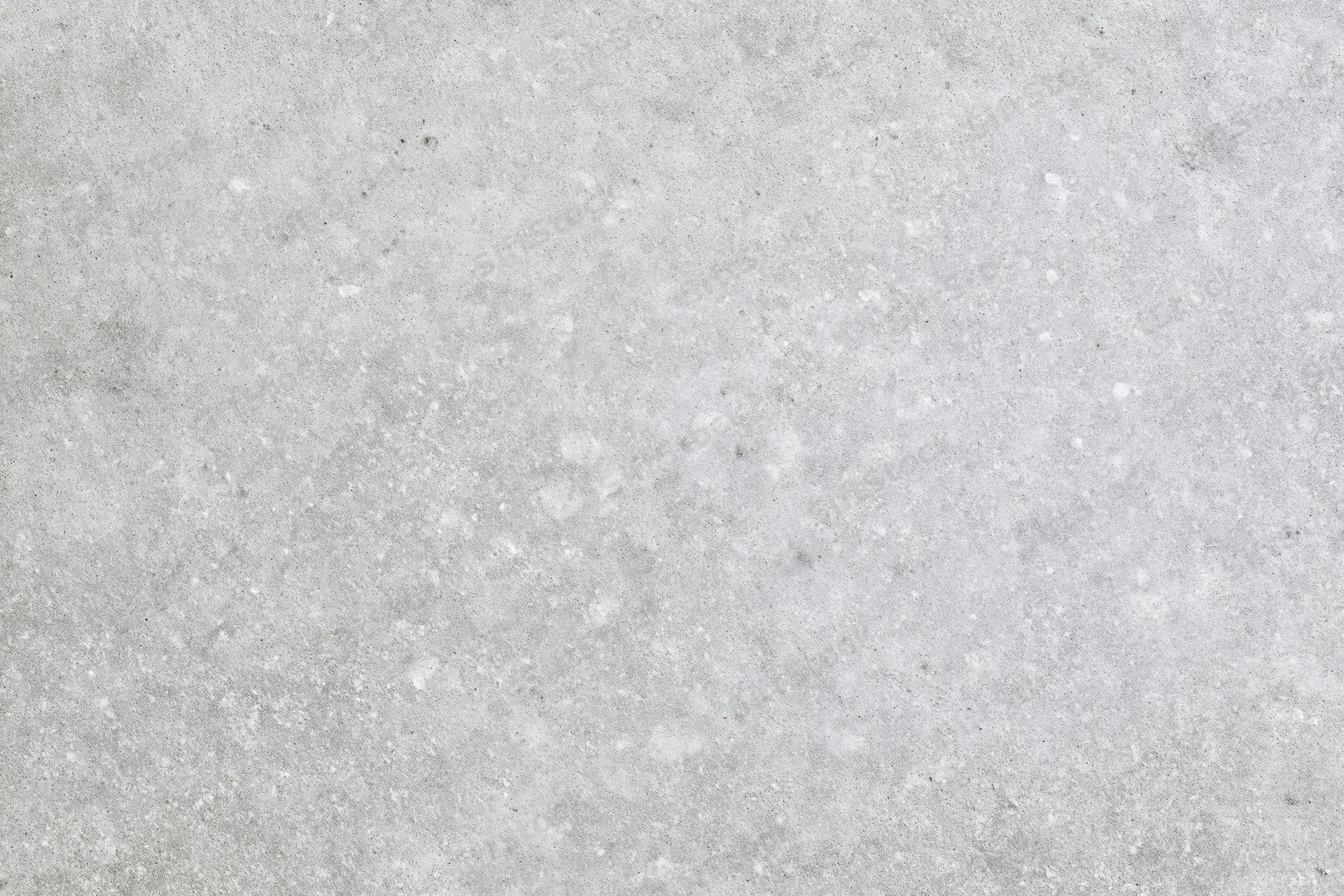Close-up of smooth grey concrete surface with subtle texture and speckles
