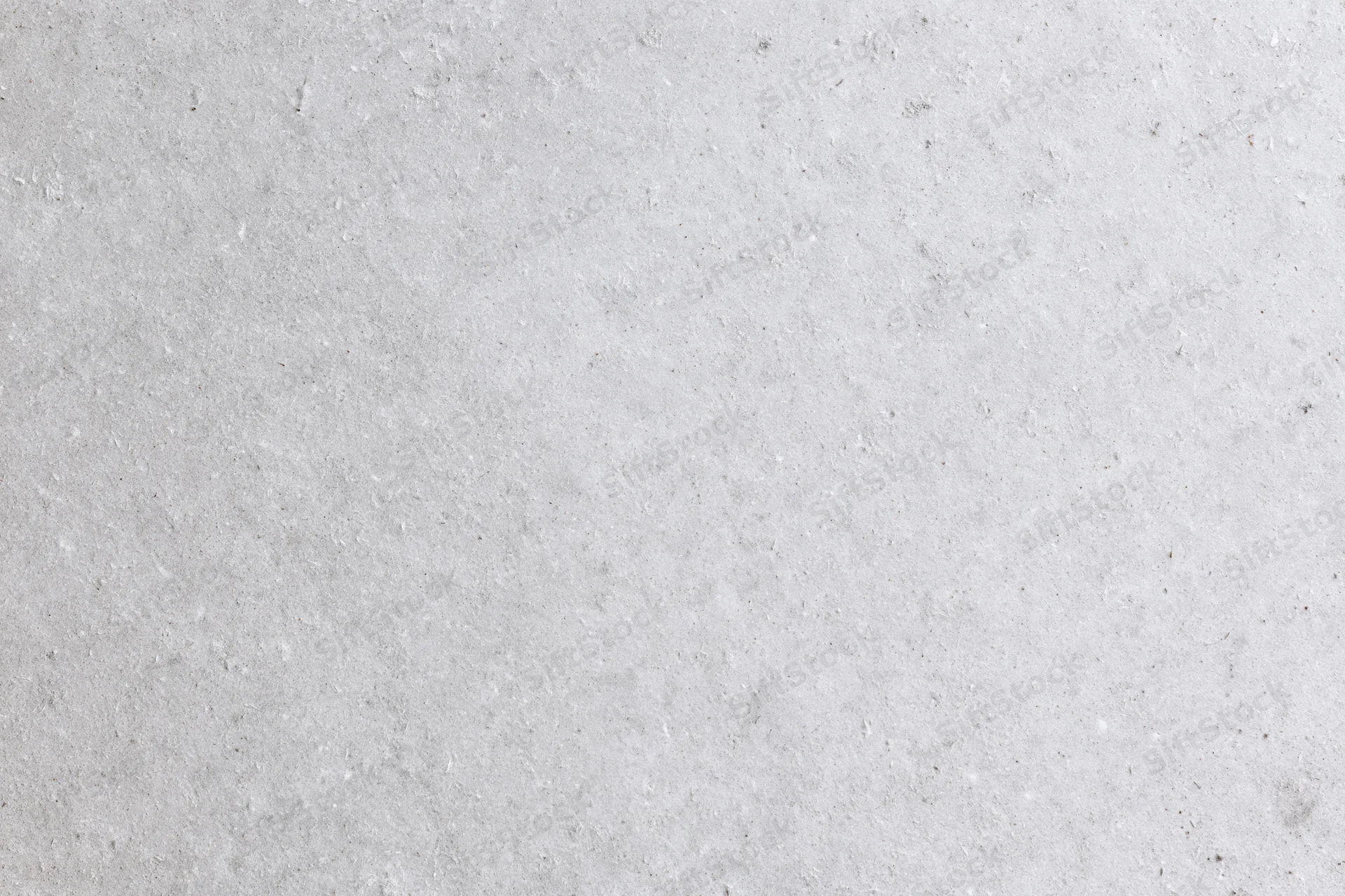 Close-up of smooth grey concrete surface with subtle texture and speckles