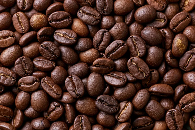 Closeup of roasted coffee beans filling the frame