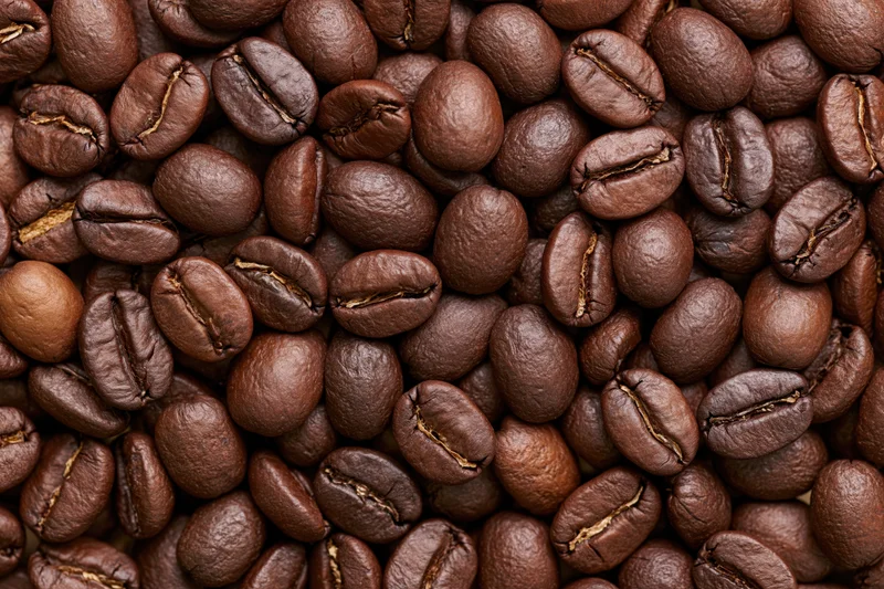 Closeup of roasted coffee beans filling the frame