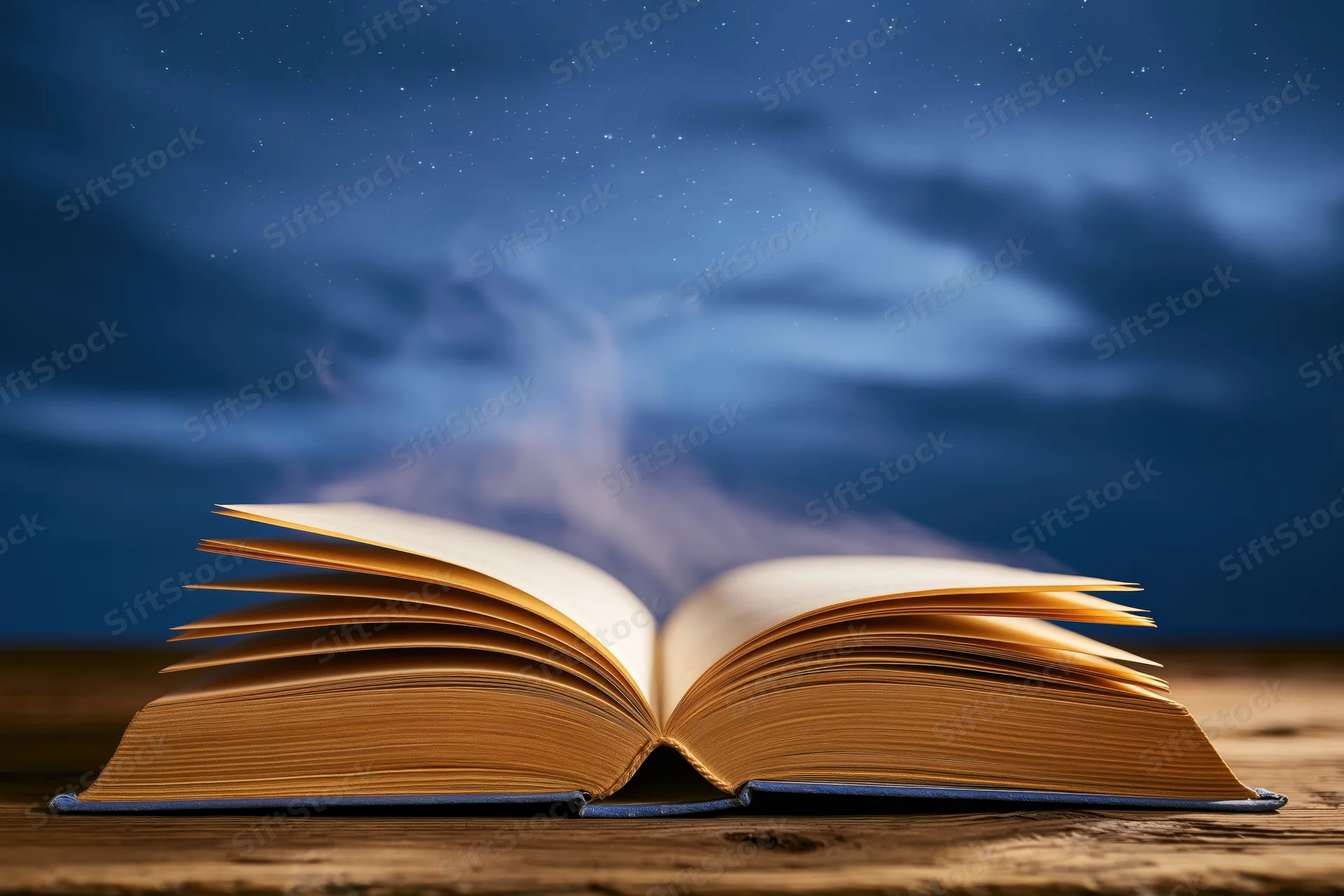 Open hardcover book with yellowed pages on wooden table under starry night sky emitting wisps of smoke