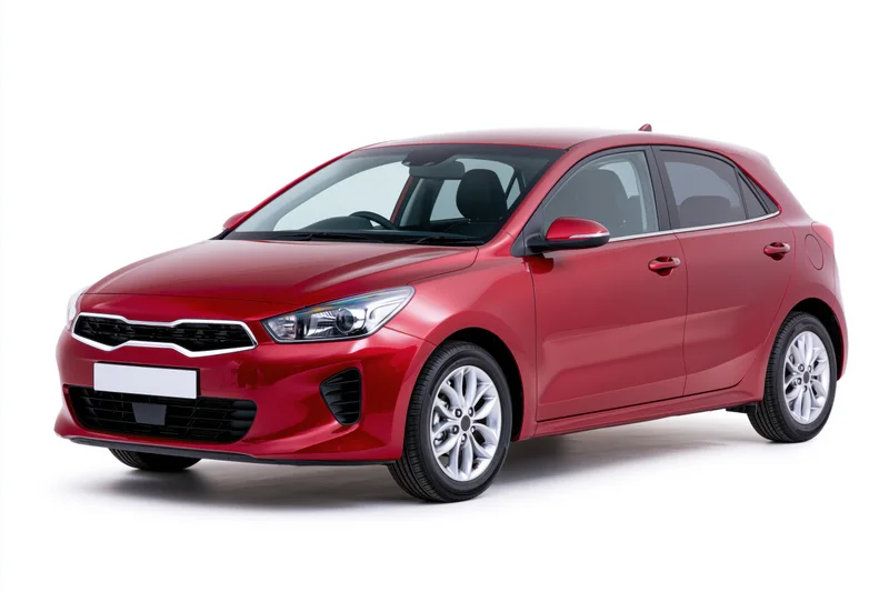 Red compact hatchback car in three-quarter front view on white background