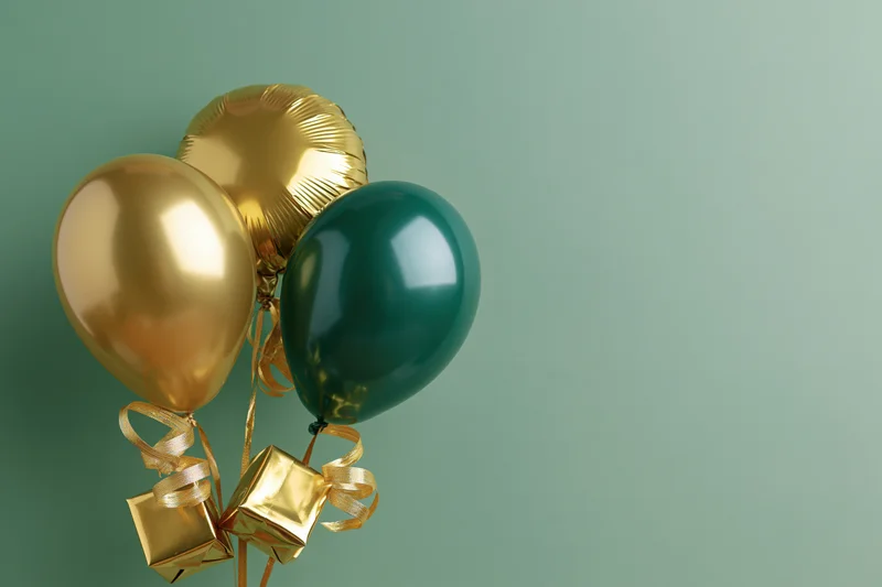 Three metallic balloons in gold and green clustered with ribbons and small gift boxes against a muted green background