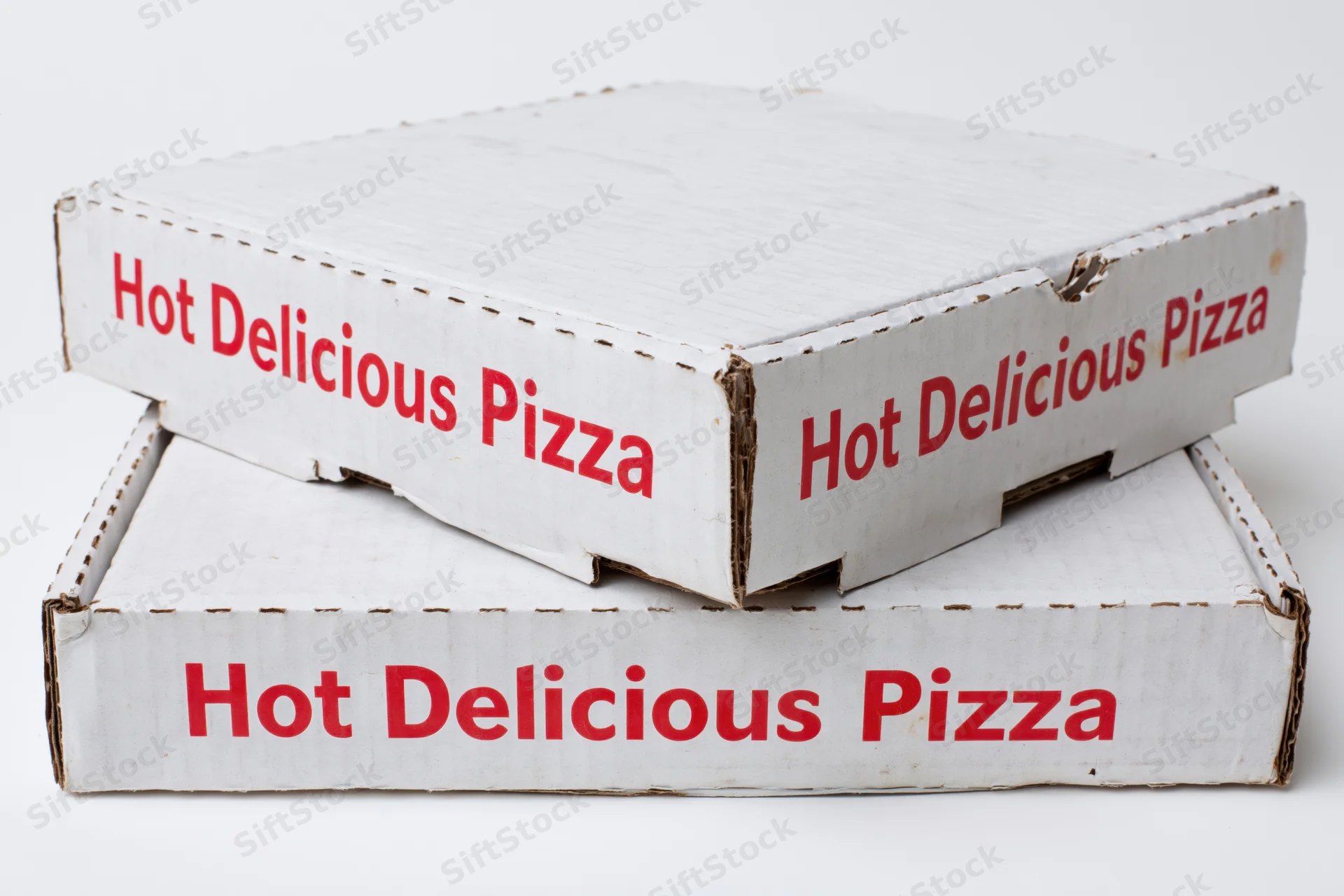 Two white cardboard pizza boxes stacked with red text on plain background