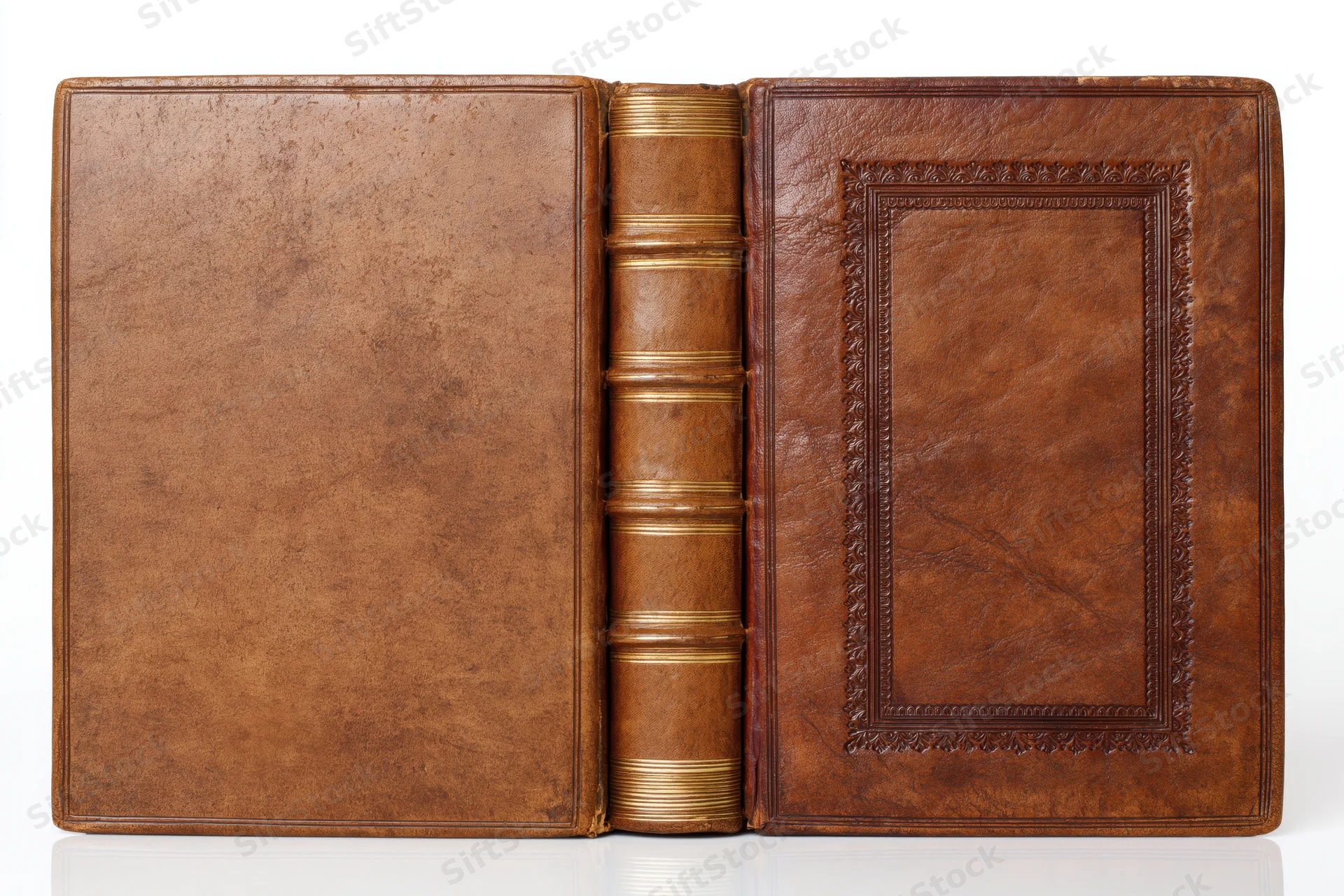 Antique leather-bound book open to show front and back covers and spine against white background