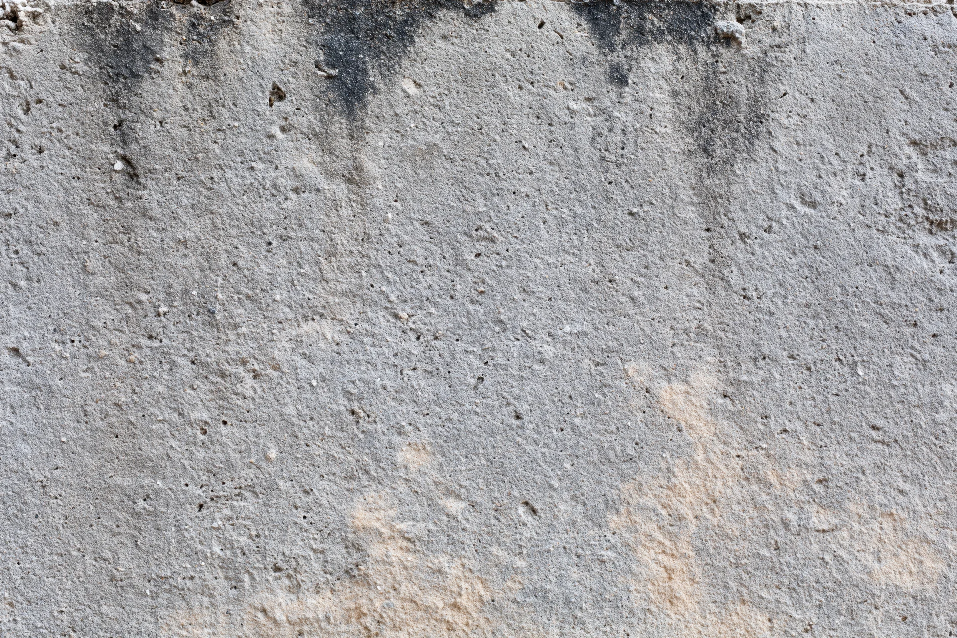 Weathered concrete wall surface filling the frame