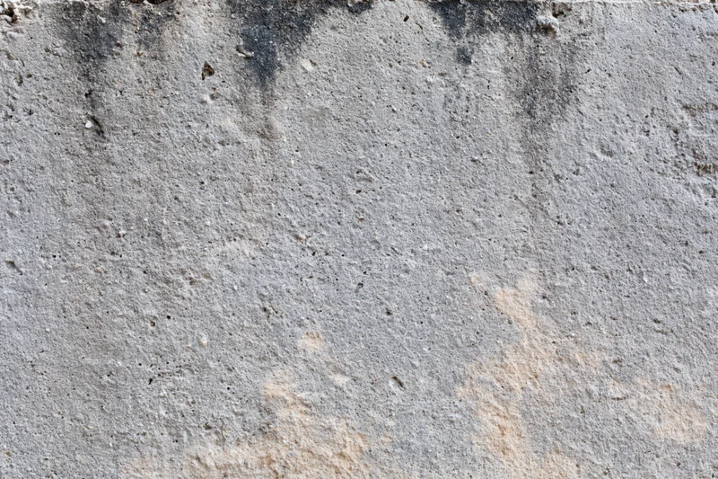 Weathered concrete wall surface filling the frame