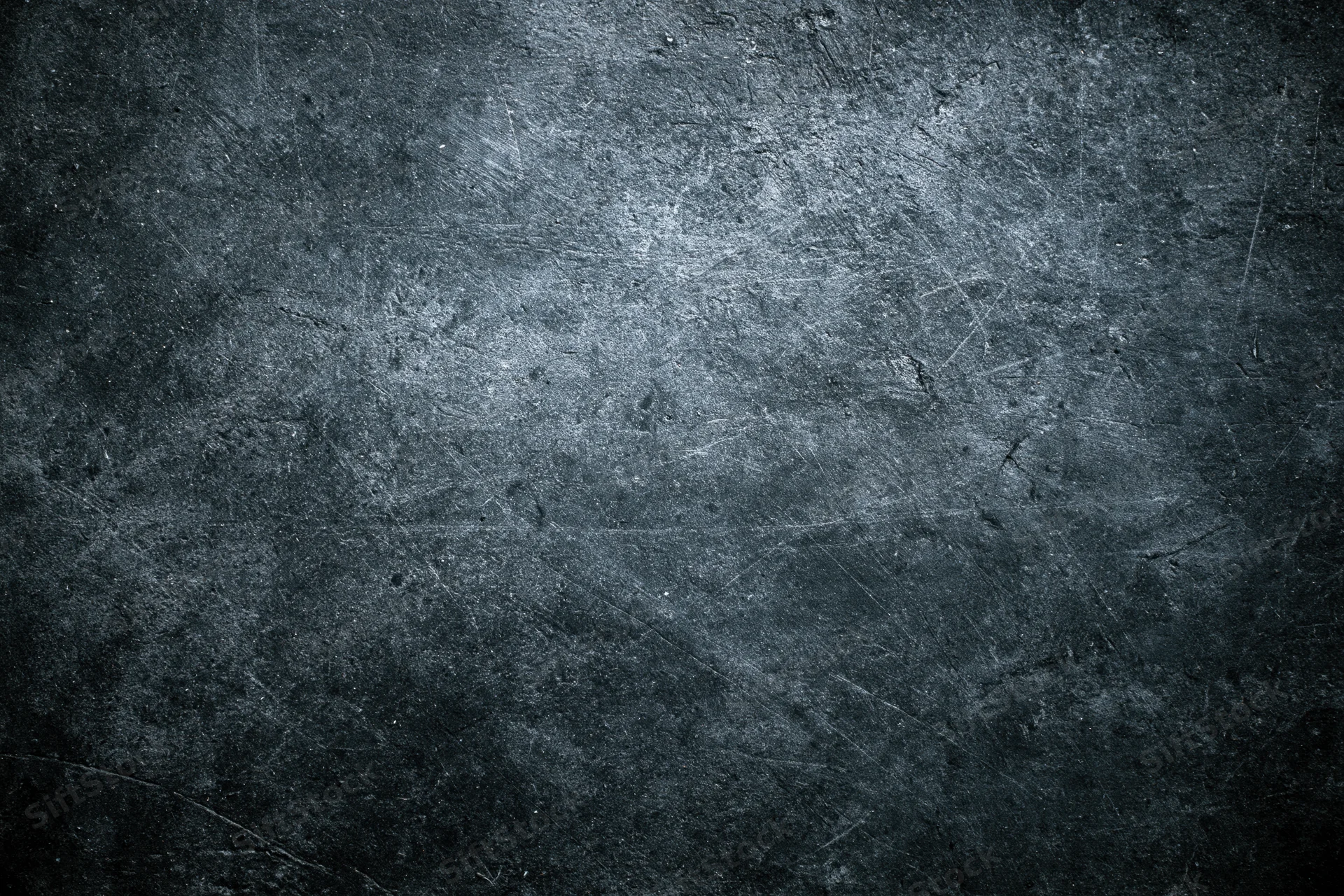 Weathered concrete wall surface filling the frame with scratches and texture