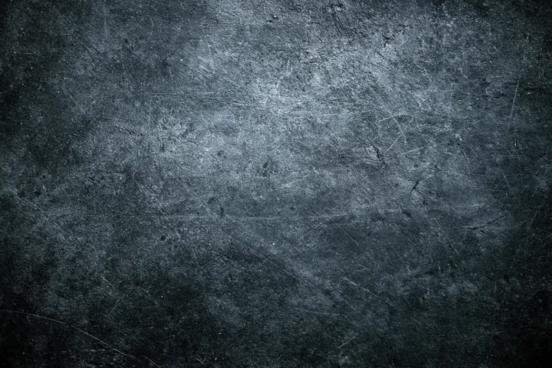 Weathered concrete wall surface filling the frame with scratches and texture