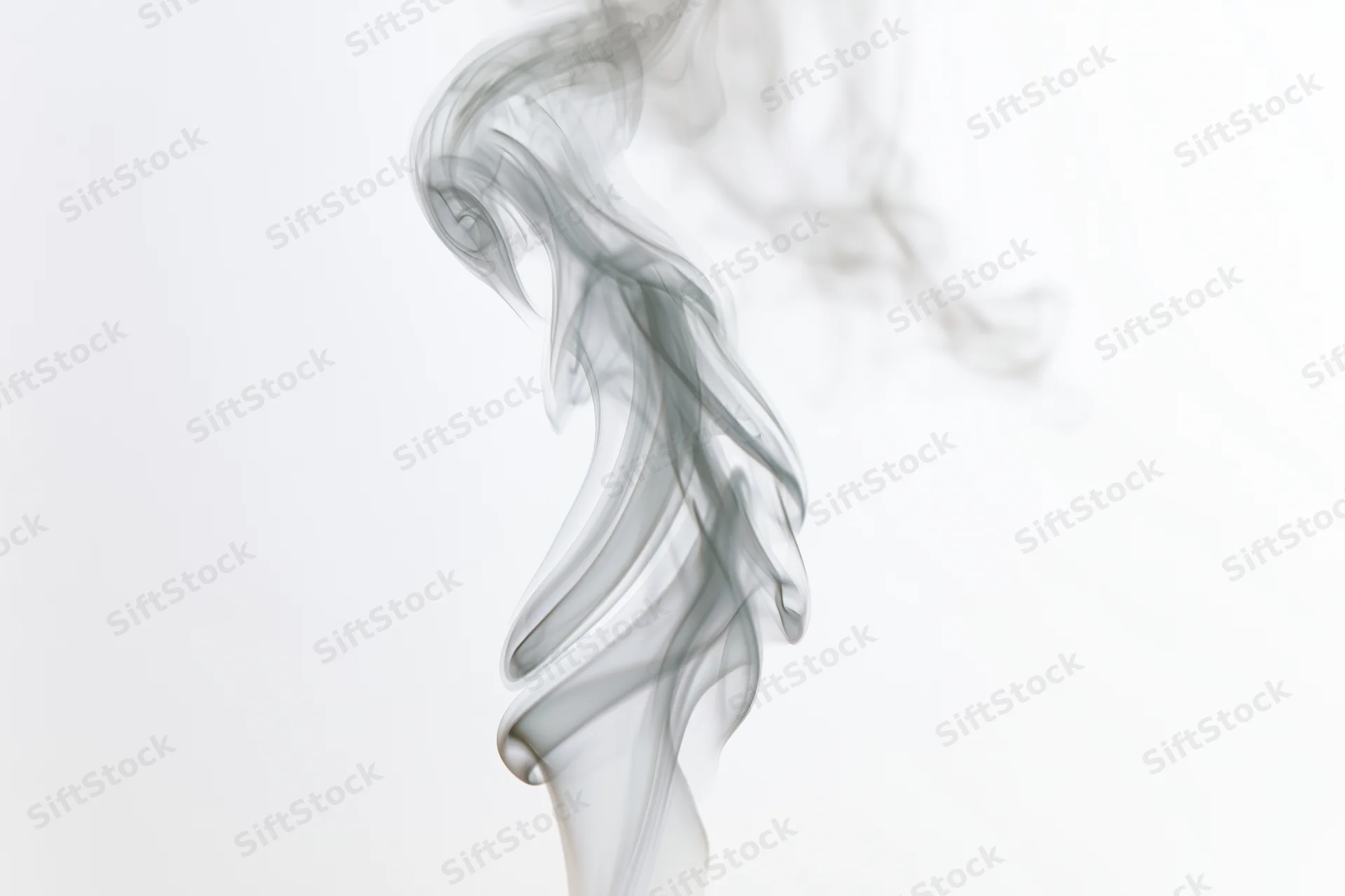 Wispy smoke plume rising and curling against a white background