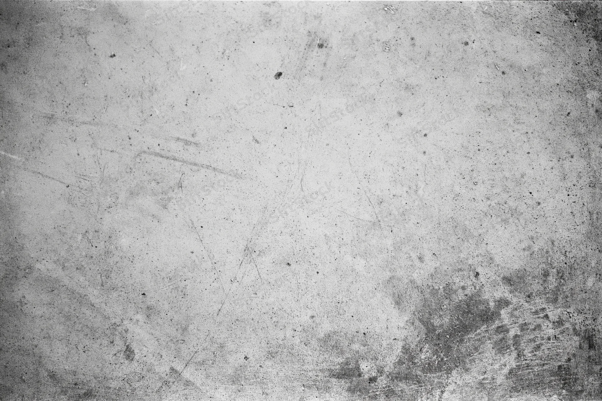 Worn concrete wall surface filling the frame with visible scratches and stains