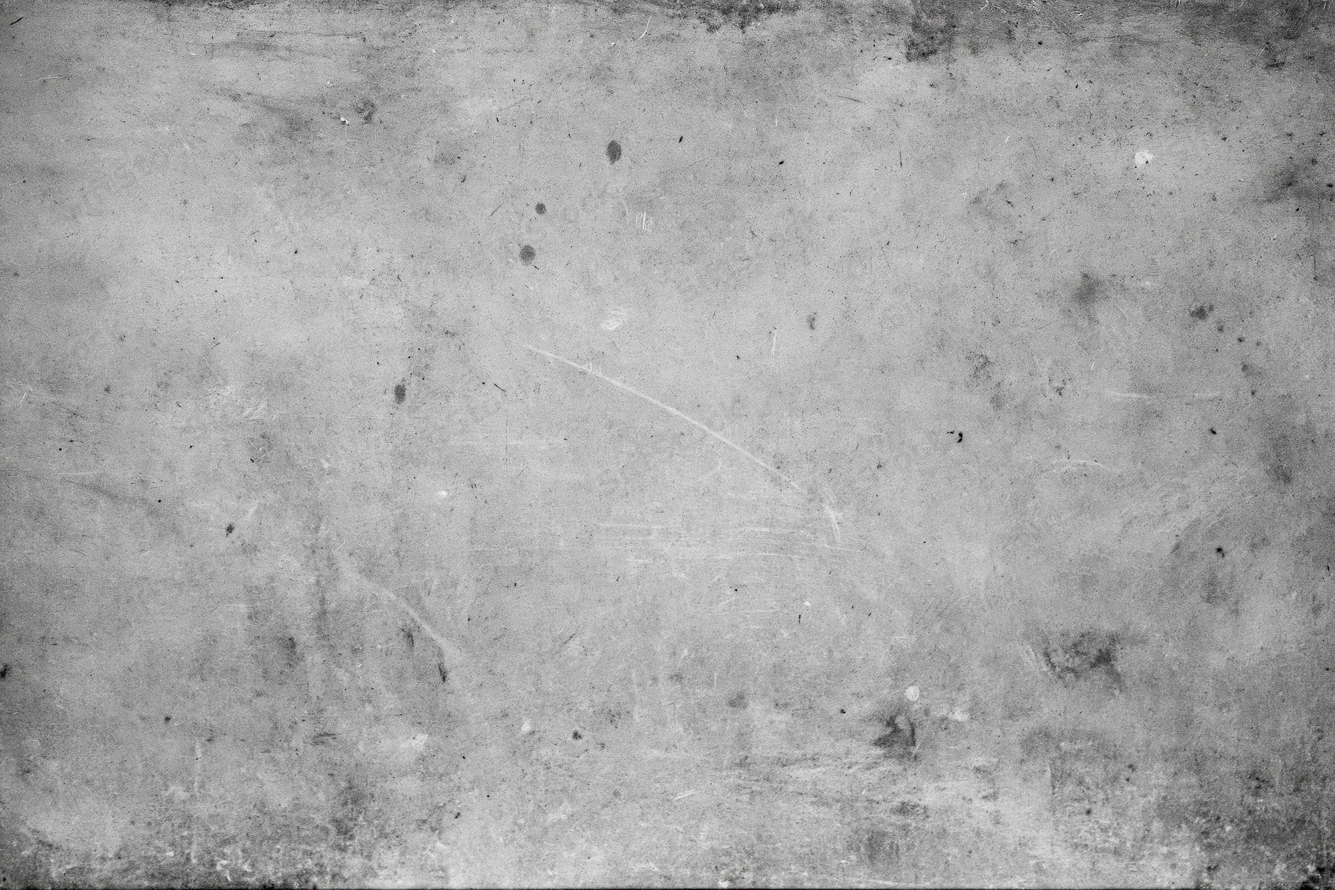 Worn concrete wall surface filling the frame with visible cracks and stains