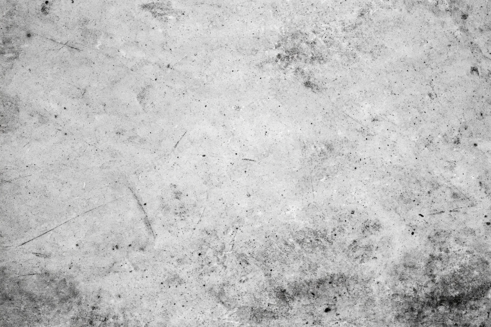 Worn concrete wall surface filling the frame with visible scratches and stains
