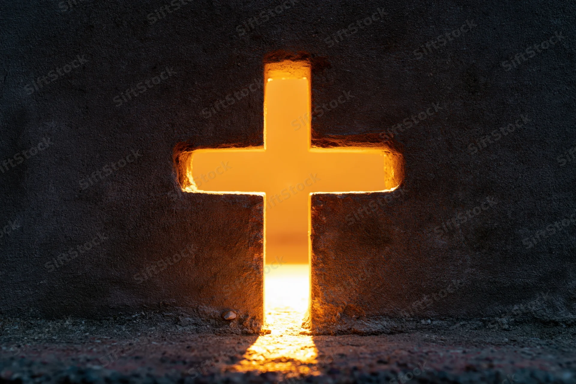 Glowing christian cross cut into dark concrete wall with warm light shining through