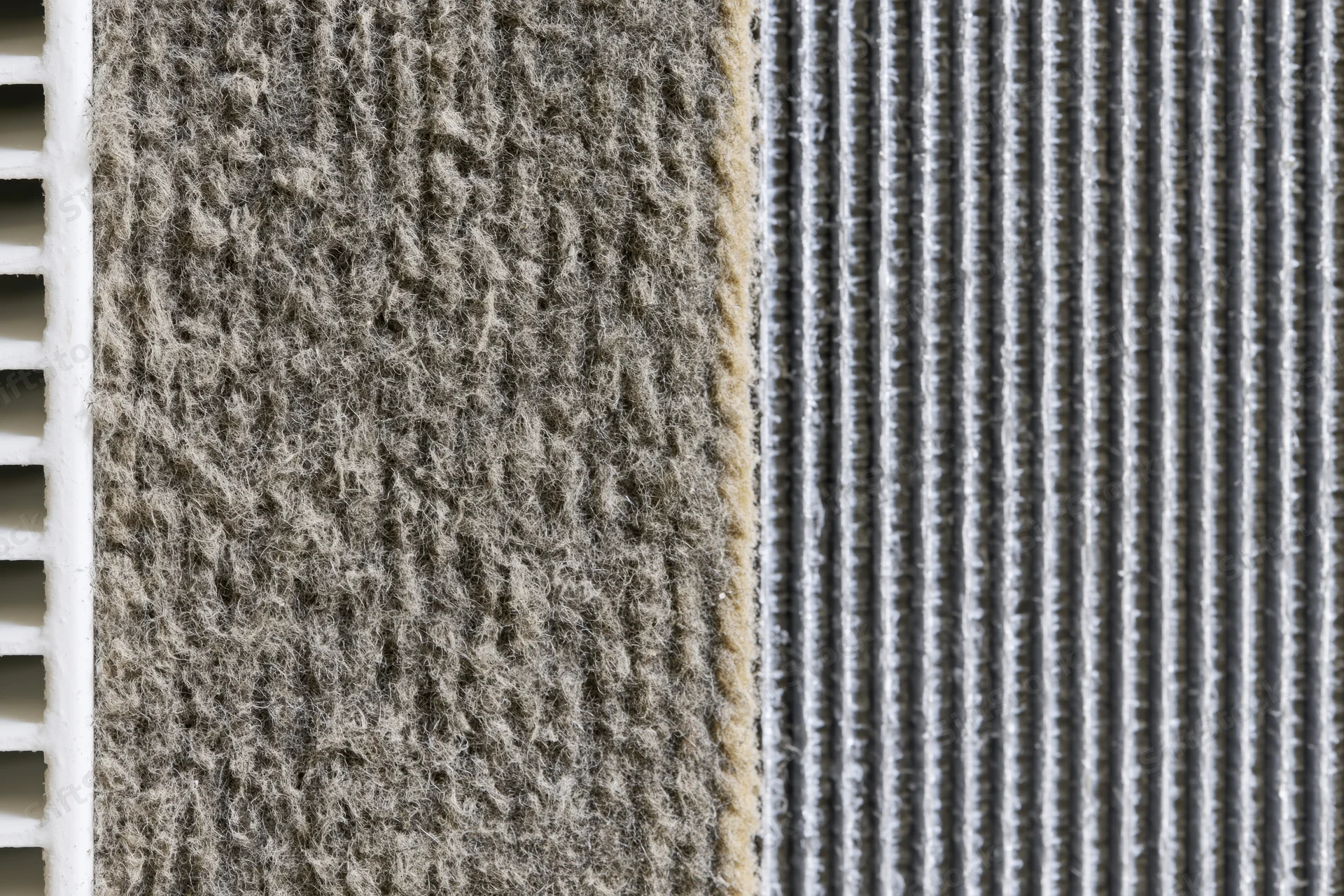 Close-up split view of hvac air conditioner coil fin and filter material