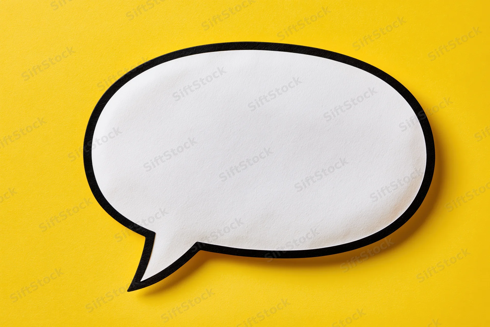 Blank white speech bubble with thick black outline on yellow background