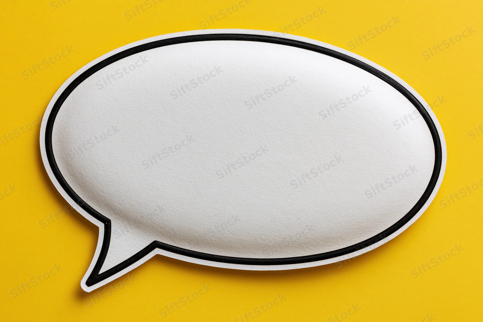 Blank white speech bubble with thick black outline on yellow background
