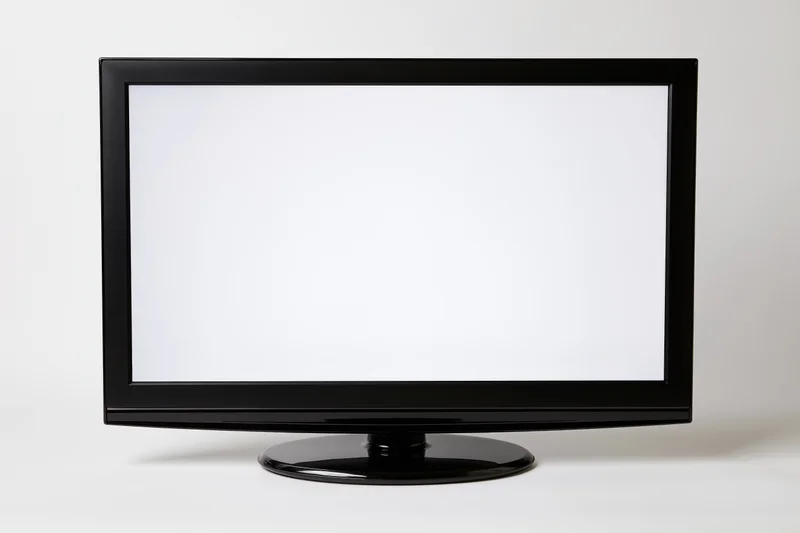 Flat-screen led television with blank white screen on white background