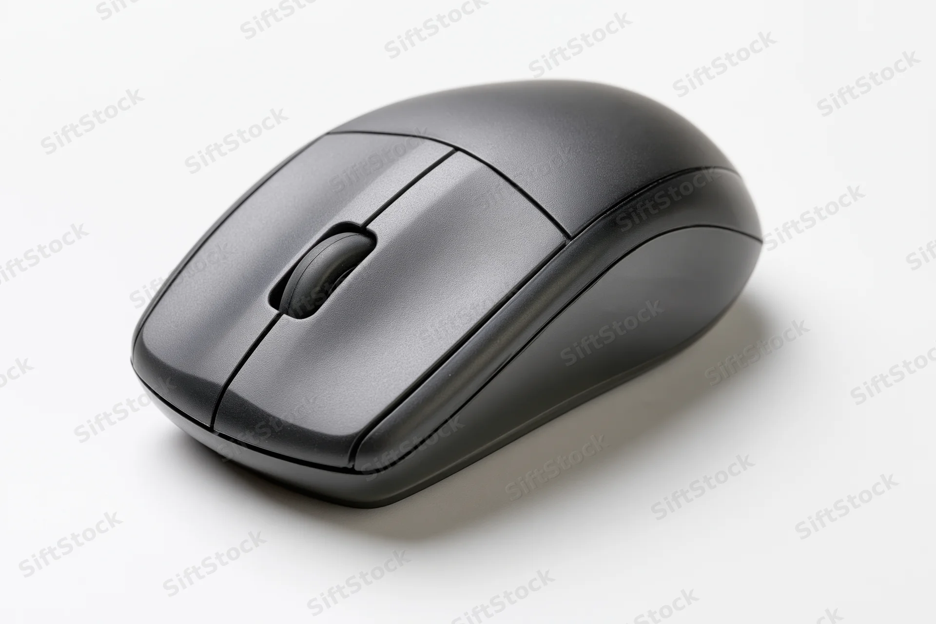 Matte black wireless computer mouse on plain white surface